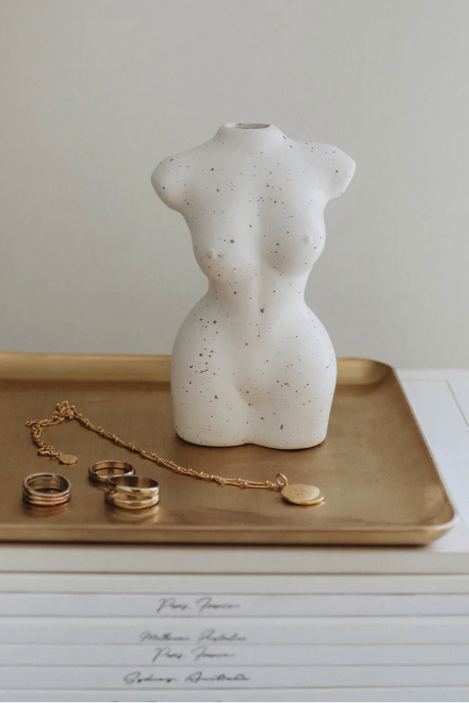 Figure Vase, by PapierHQ

Our ceramic figure vase celebrates all women. A beautiful piece to use as a decorative item in your home or the perfect size for dried flowers. It's minimalistic design oozes style. A beautiful sculpture created from ceramic and hand sprayed creating a one of a kind piece with flecking detail that is unique to you. The perfect addition to your home.&nbsp;

Dimensions: 8cm x 6cm x 12.5cm