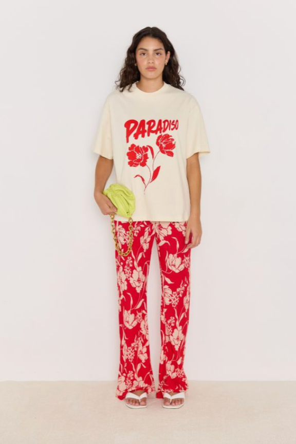 Poppy Pants - Red Floral, by Minkpink

The Poppy Pants bring relaxed tailoring to your summer wardrobe. Designed in a standout red floral print, they feature a flattering high waist and wide leg fit that elongates the silhouette. Wear them solo with the Paradiso Tee for easy, breezy style.