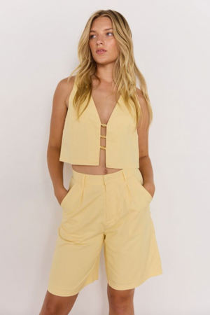 Gigi Bermuda Short - Butter, by Minkpink

The Gigi Butter Yellow Linen High-Waist Bermuda Short is your easy-breezy summer go-to. In a soft butter yellow, these tailored shorts feature a high-rise waist, front pleats, and a relaxed longer-line leg for a polished yet comfortable fit. Crafted from a breathable cotton-linen blend, they’re perfect for both casual days and warm-weather outings.&nbsp;