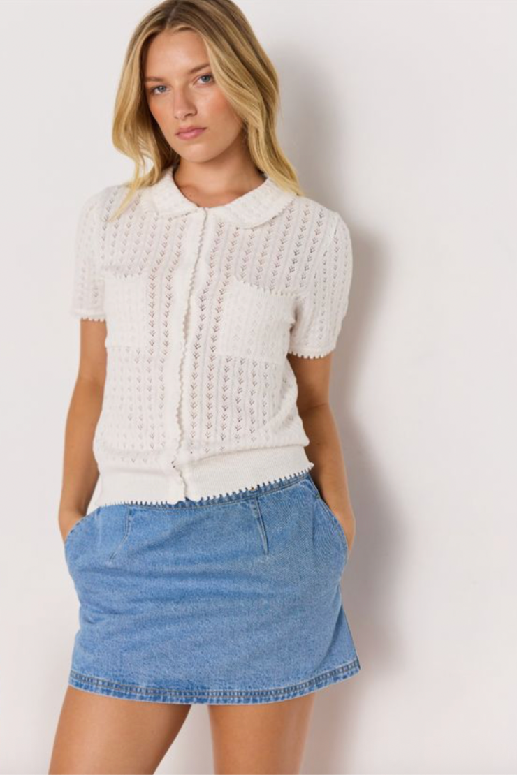 Lila Pointelle Knit Tee - White, by Minkpink

A vintage-inspired staple, this white knit tee is crafted in soft cotton with delicate pointelle detailing, scalloped trims, and a sweet Peter Pan collar. Perfect for dressing up denim or pairing with skirts.