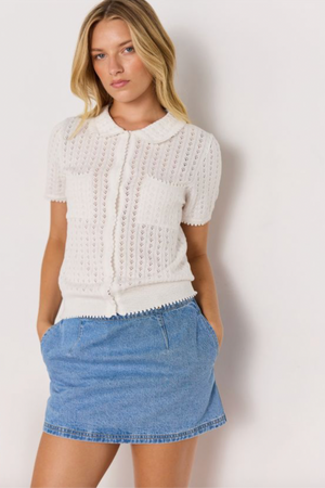 Lila Pointelle Knit Tee - White, by Minkpink

A vintage-inspired staple, this white knit tee is crafted in soft cotton with delicate pointelle detailing, scalloped trims, and a sweet Peter Pan collar. Perfect for dressing up denim or pairing with skirts.