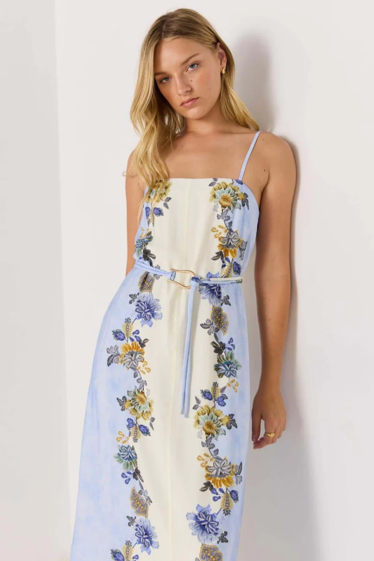 Lucia Midi Dress - Blue &amp; Cream Floral

The Lucia Blue &amp; Cream Floral Midi Dress is a breezy, romantic style made for sunny days and balmy nights. Featuring a watercolour blue and cream base with vibrant floral prints, it’s designed with slim spaghetti straps, a square neckline, and a detachable belt to define the waist. The flowing midi skirt adds an effortlessly elegant touch, perfect for garden parties or seaside escapes.
