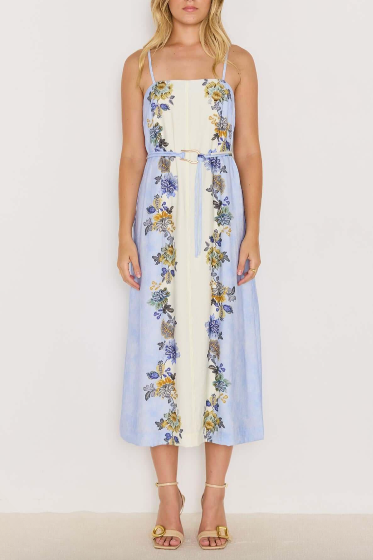 Lucia Midi Dress - Blue &amp; Cream Floral

The Lucia Blue &amp; Cream Floral Midi Dress is a breezy, romantic style made for sunny days and balmy nights. Featuring a watercolour blue and cream base with vibrant floral prints, it’s designed with slim spaghetti straps, a square neckline, and a detachable belt to define the waist. The flowing midi skirt adds an effortlessly elegant touch, perfect for garden parties or seaside escapes.
