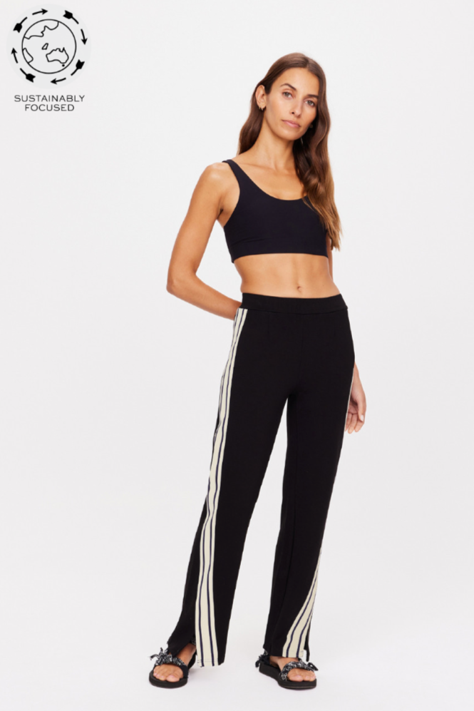 The Origional Petra Flare - Black/Natural, by The Upside

For a directional take on athleisure, discover the Petra Flare.

A fresh look to our original, best-selling black Petra Flare
Flared pant with splits at front.
Contrast knitted tape down side seams adding a sporty touch.
Tonal embroidered arrow at back.
Elasticated waist.
Side seam pockets
Soft suiting Ponti fabrication
Please refer to studio images for accurate colour of garment