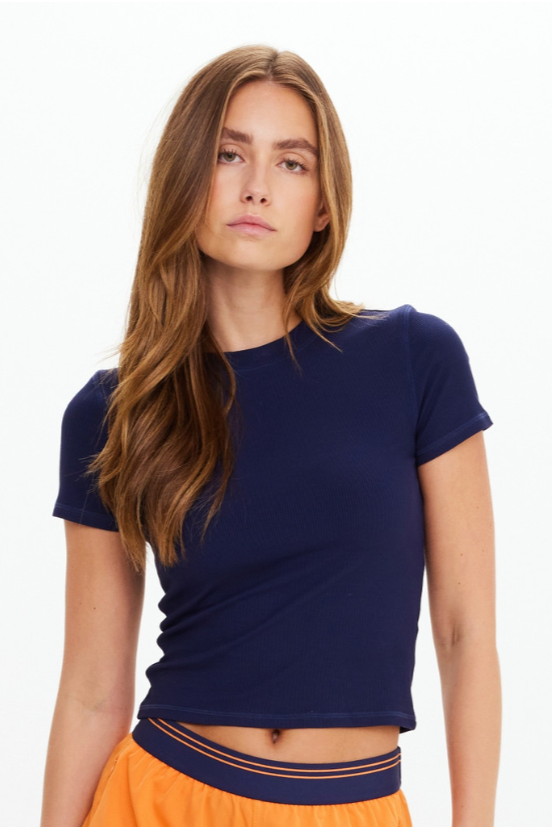 Shelter Fitted Tee - Navy, by The Upside

A fitted tee with rib texture and clean lines

Fitted t-shirt in navy
Rib fabrication
Moisture wicking
Embroidered arrow logo at back neck
Please refer to studio images for accurate colour of garment