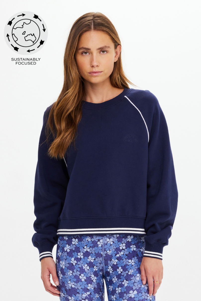 Astra Paloma Crew - Navy, by The Upside

The Astra Paloma Crew pairs everyday ease with classic hues

An oversized crew in navy
100% brushed organic cotton loopback fabrication
The Upside embroidered logo at front chest
Ribbed neckline
Ribbed cuffs and hem with white stripe accent
Drop shoulder relaxed styling with white piping detail