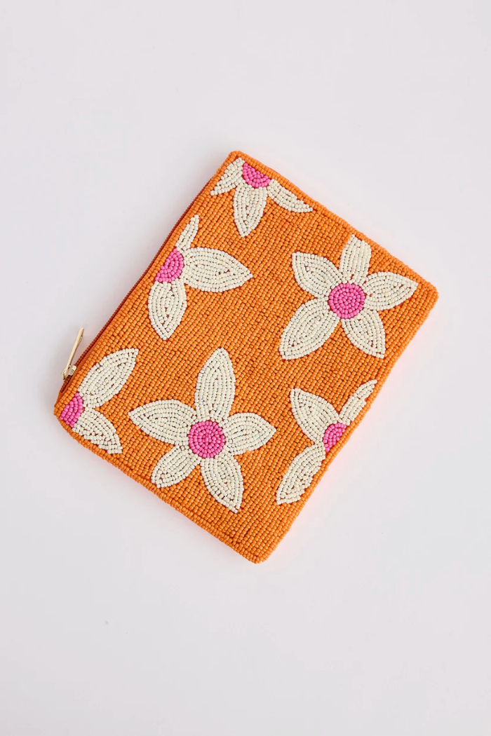 Firenze Clutch - Orange, by Holiday
Beautiful beaded floral design
Satin back
Lovingly handmade in India

Fabrication:
Glass Bead / Iron / Satin fabric&nbsp;
