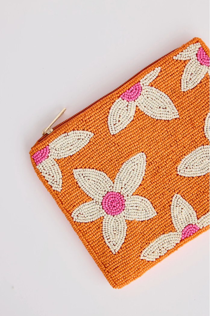Firenze Clutch - Orange, by Holiday
Beautiful beaded floral design
Satin back
Lovingly handmade in India

Fabrication:
Glass Bead / Iron / Satin fabric&nbsp;