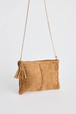 Munroe Suede Leather Bag - Tan, by Holiday

The Munroe Suede Bag in Tan is a versatile and stylish accessory designed to take you from day to night with ease. Featuring soft suede fabric with intricate braided detailing, this bag combines texture with timeless style. The gold chain strap adds a touch of polish, while the tassel zipper pull keeps it relaxed and playful. Spacious enough to hold your essentials, it’s the perfect finishing touch to any outfit. The chain can be removed and the bag used as a clut