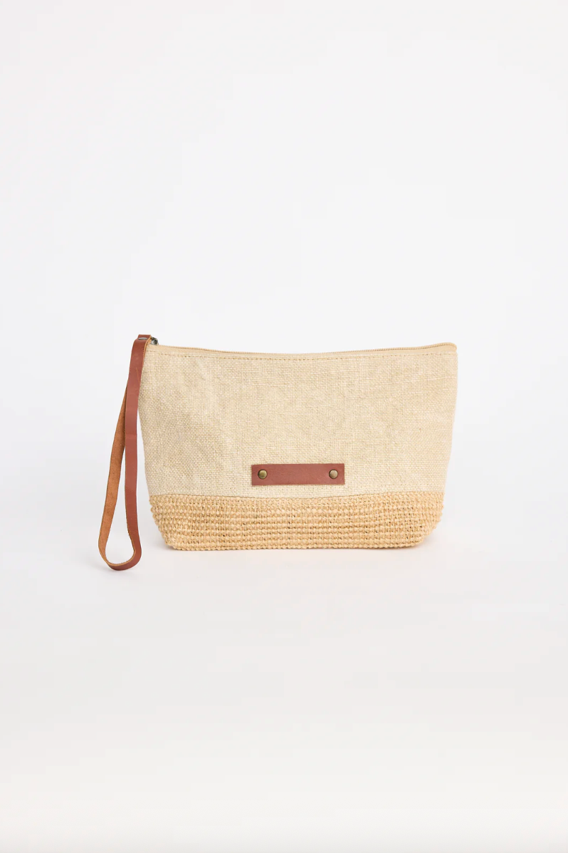 Beachcomber Clutch - Natural, by Holiday

A timeless summer essential, the Beachcomber Clutch from Holiday Trading is the perfect lightweight accessory to take you from beach to bar. Crafted from natural woven fibres, it’s designed with a relaxed yet refined look that pairs effortlessly with summer dresses, linen outfits, or resort wear. Compact yet spacious enough for your daily essentials, this clutch is both stylish and practical.