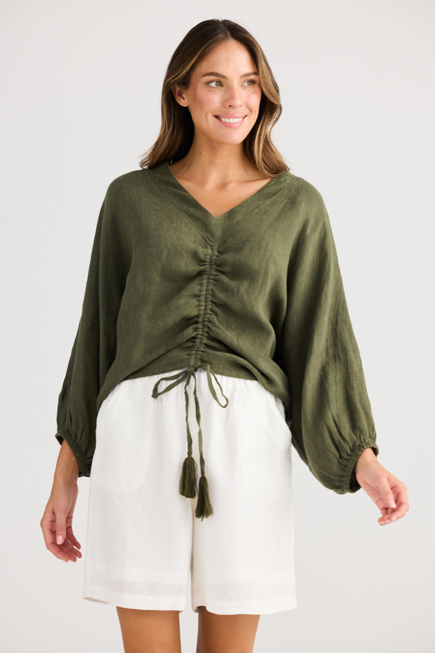 Happy Hour Top - Olive, by Holiday
V-neckline

Centre front ruching with tie

Oversized fit

Elasticated back hem