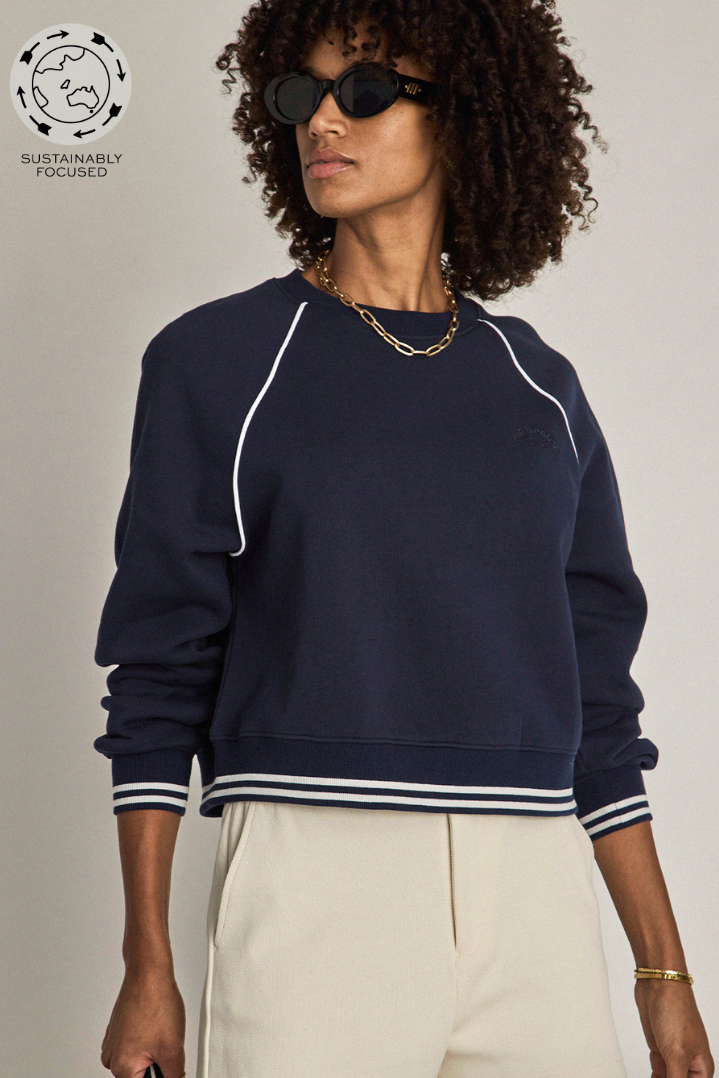 Astra Paloma Crew - Navy, by The Upside

The Astra Paloma Crew pairs everyday ease with classic hues

An oversized crew in navy
100% brushed organic cotton loopback fabrication
The Upside embroidered logo at front chest
Ribbed neckline
Ribbed cuffs and hem with white stripe accent
Drop shoulder relaxed styling with white piping detail