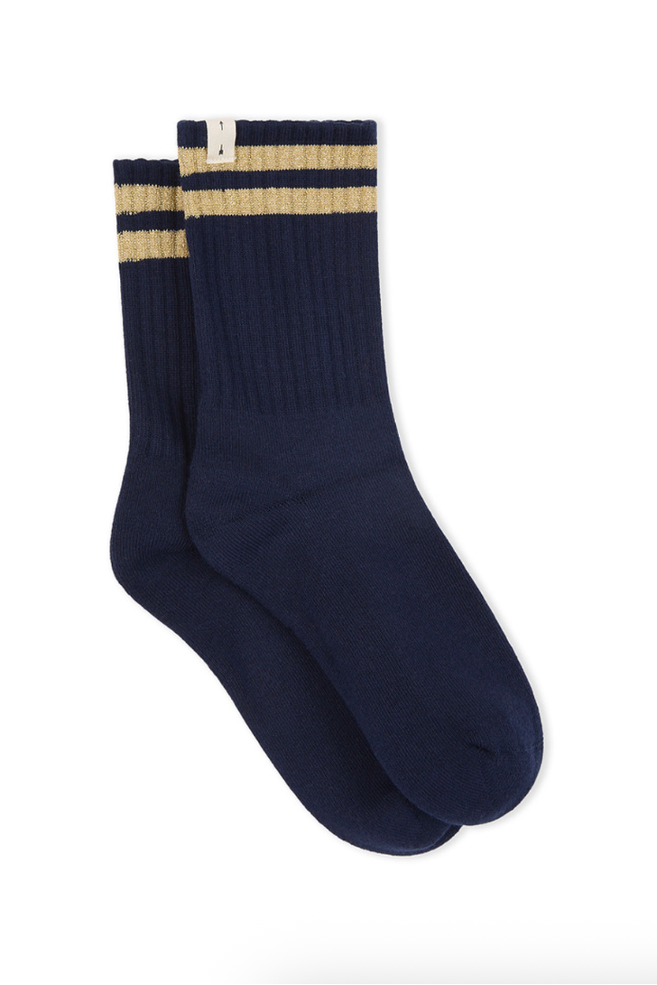 Everyday ease with a twist - the Curio Crew Sock in navy and gold, by The Upside

Crew sock in classic navy
Jacquard stripes in gold metallic yarn
Cream arrow logo pip at edge
Please refer to studio images for accurate colour of garment