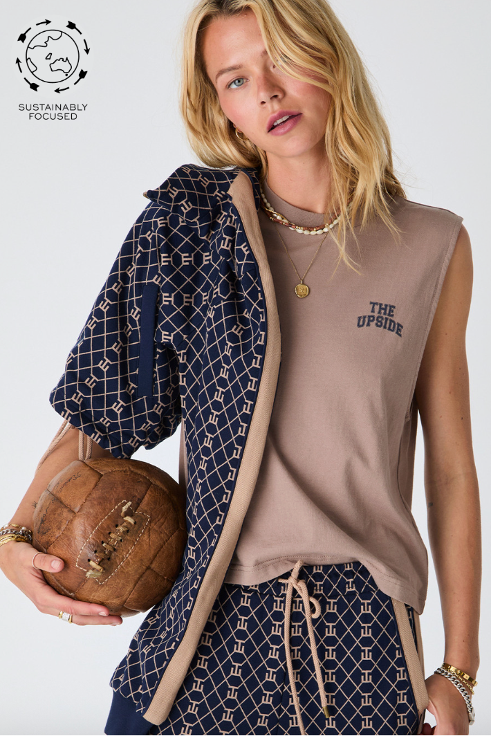 Dawson Tank - Mocha, by The Upside

A soft jersey tank that brings retro sport into the everyday

Mid length boxy muscle tank
100% organic cotton jersey in mocha
Soft ribbed neckline
Printed navy varsity logo at front chest
Please refer to studio images for accurate colour of garment