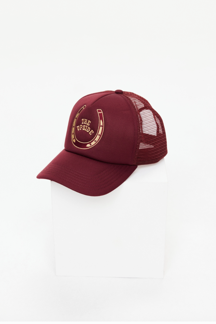 Cheval Trucker Hat - Bordeaux, by The Upside

A retro-inspired cap with structured shape and breathable mesh perfect for sun-soaked days.

Classic trucker hat in burgundy with foam front and mesh back
Adjustable snapper at back
Embroidered horseshoe and western logo at centre front
Please refer to studio images for accurate colour of garment