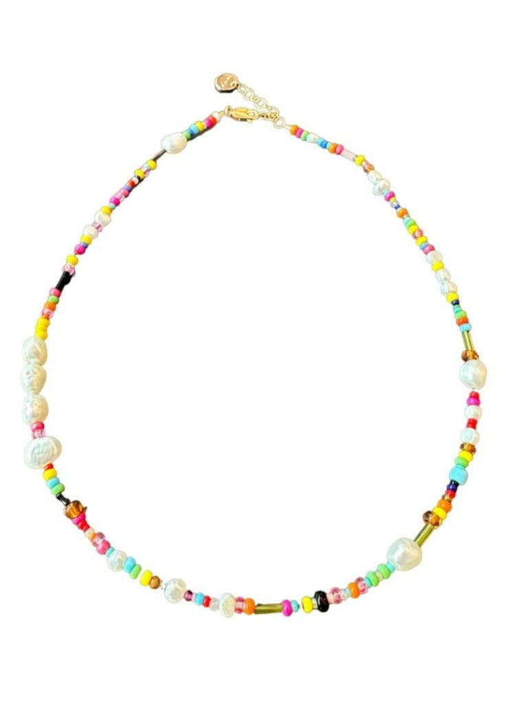 A Bit of Fun Necklace, by Vania This joyful necklace is a one-of a kind piece made with glass, natural gemstones and sprinkled with freshwater pearls. Finished with 14ct gold-filled. 