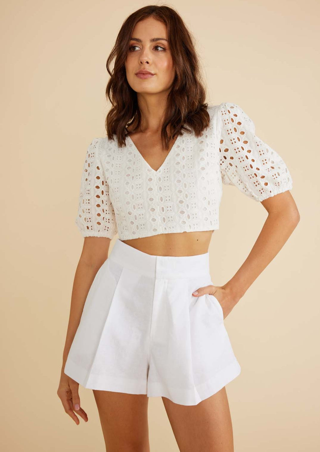 Noa Short - White, by MinkPink The Noa Short is the perfect summer basic. Featuring front pleats and a flat waistband, these shorts are both versatile and elevated. Pair with the Amina Wrap Blouse.  - Front pleats - Flat thick waistband - Pockets - Concealed fly front