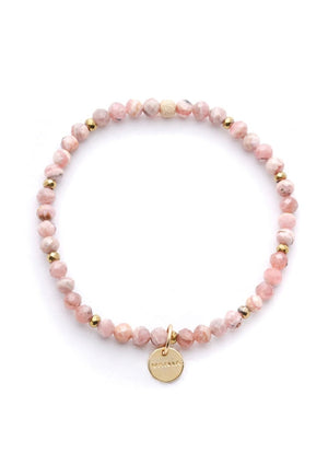 Aurora Bracelet Designed with Argentinian Rhodochrosite, the rosy hues and dusty tones of the Aurora bracelet give this piece an understated elegance. Witnessing the dancing lights of an Aurora is awe-inspiring and just like the properties of rhodochrosite, invites us to look inward.  Wear this Rhodochrosite bracelet to evoke forgiveness, compassion, and self-love.