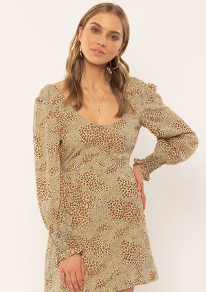 A mixed animal print mini dress with deep scoop neckline, and slightly puffy long-sleeves