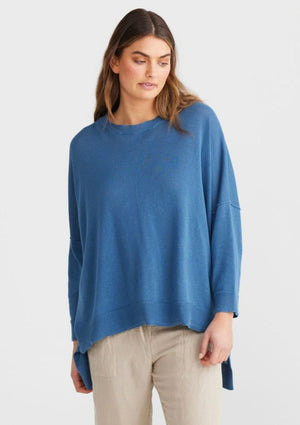Umbria Fine Knit - Blue Steel, by Shanty Corp. FREE SIZE GARMENT ROUND NECK DROPPED SHOULDER NARROW SLEEVE HIGH-LOW HEMLINE FINE RIB DETAILING   Fit:  One Size - Fits Sizes 8-14  Bust (cm): 157  Fabric + Care:  100% Cotton  COLD DELICATE MACHINE WASH INSIDE OUT WITH LIKE COLOURS DO NOT BLEACH, SOAK OR RUB (X) DO NOT TUMBLE DRY (X) LINE DRY IN SHADE WARM IRON INSIDE OUT DO NOT DRY CLEAN (X)