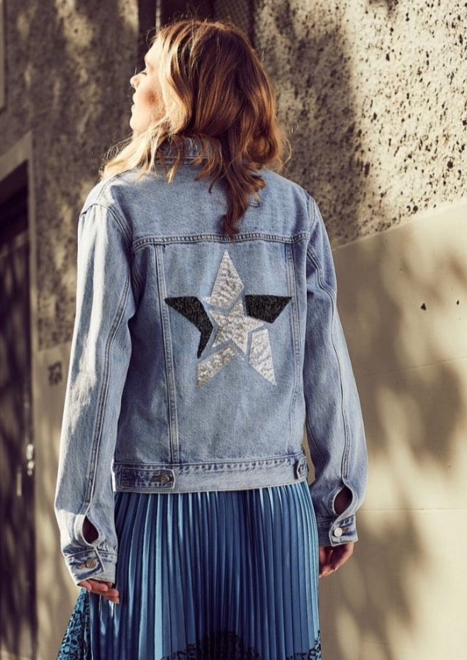 The Star Denim Jacket - Mid Blue, by The Others  Our denim jacket shape in Mid Blue wash with sequin star detail on the back and featuring our Others logo silver buttons.  100% Organic Cotton.  Model is 179cm tall and is wearing a size 2/S