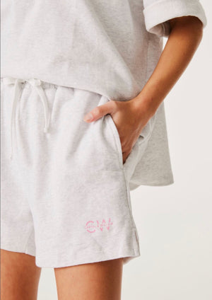 Lottie Short - Grey Marle, by Cartel & Willow  The ultimate off-duty shorts.  Pull on track short Inseam side pockets Small CW logo in pink print on the left hem 100% cotton terry marle fabric Ellery 2022 collection