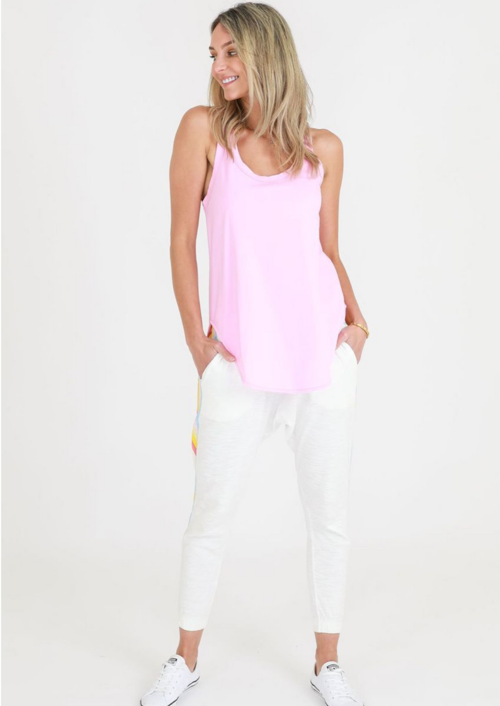 Hamilton Tank - Neon Gum, by 3rd Story  The Hamilton Tank by 3rd Story is a wardrobe staple. A racerback singlet with a scooped neckline, the Hamilton Tank is perfectly styled as a layering piece or worn on its own.  It has a rounded hem that has a slightly longer length - front and back.  Fit: