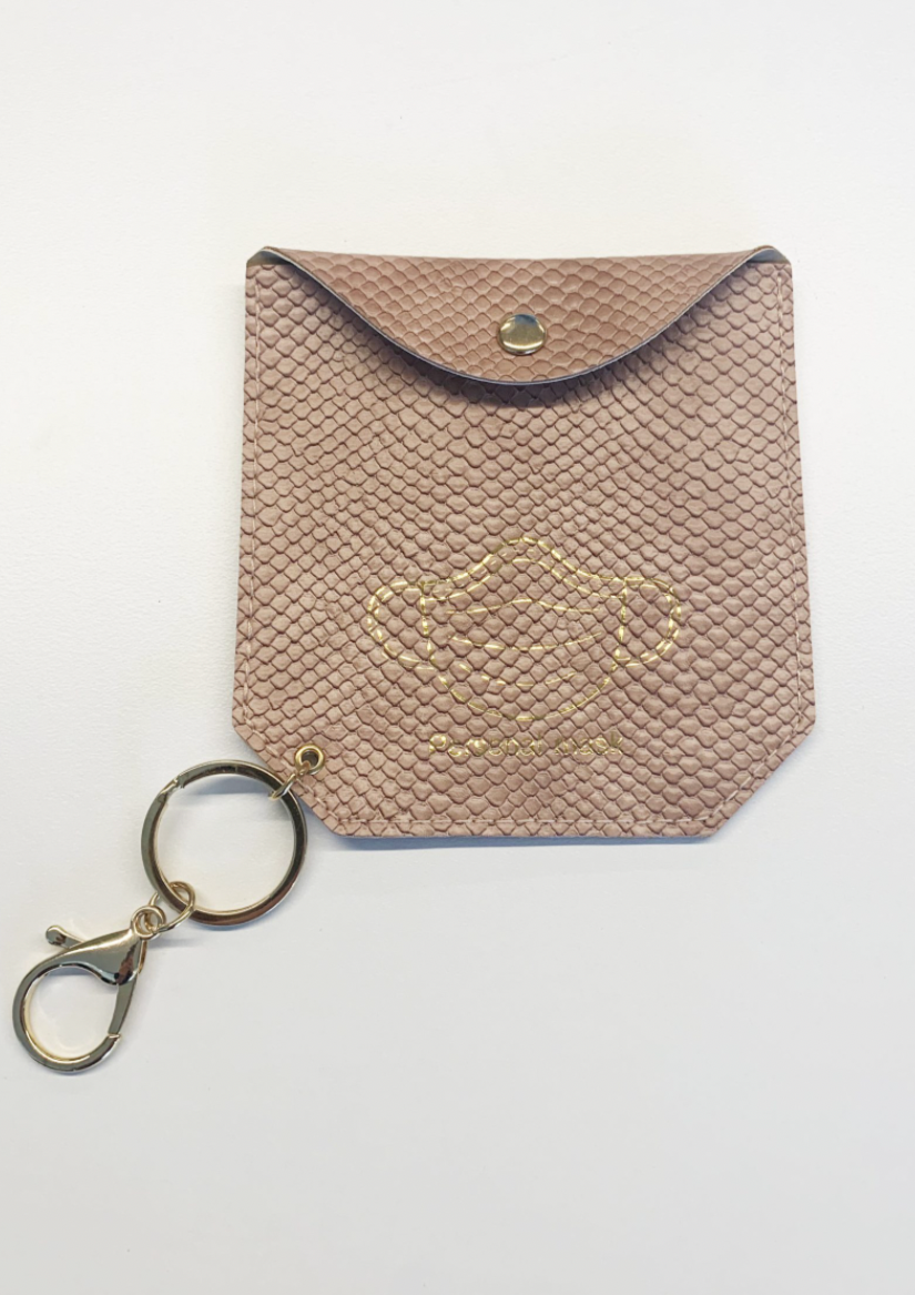 Face Mask Holder - Rose Snake, by Stella + Gemma Keep your mask nice and handy and germ free in this cute wee mask holder from Stella and Gemma.  Key chain attached for easy access on your keys.
