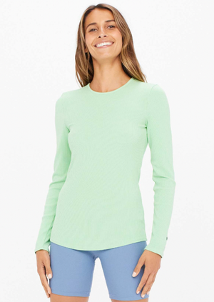 Solstice Giselle Top - Neo Mint, by The Upside Nothing but blue skies up ahead in our Solstice Giselle Top.  High neck form-fitting top. Contrast embroidered arrow logo at sleeve hem. Long slim fitting sleeves. Stretchy soft rib fabrication