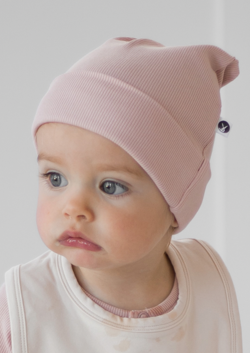 Top Knot Hat - Dusty Rose, by Burrow and Be The Essentials top knot hats are cosy and warm with lots of stretch, and now available for Winter in a ribbed fabric   Great as an extra gift idea to pair with a swaddle or wrap. 