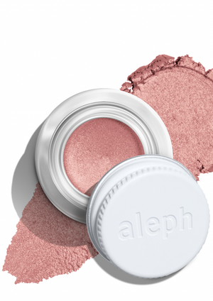 Hybrid Eye Pigment Atmos, by Aleph  **NEW RELEASE**  A velvety nude base with a coconut-ice reflect, Atmos is the perfect pop of shimmer for the eyes to suit all skin tones.