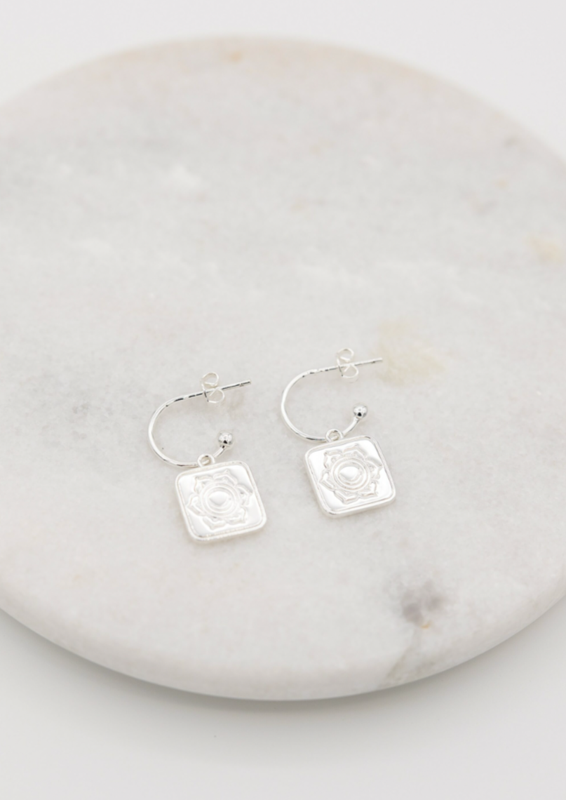 Sacred Earrings in Silver | Love Lunamei  From our Lotus Collection - The Sacral Chakra   When our Sacral Chakra is balanced it allows us to be passionate and creative, while connecting us with our true feelings and emotions. Our Lotus collection is delicately etched with lotus flower petals and a hidden crescent moon to remind us of our connection to both Mother Nature and the Lunar Phases