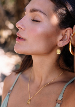 Sacred Earrings in Gold | Love Lunamei  From our Lotus Collection - The Sacral Chakra   When our Sacral Chakra is balanced it allows us to be passionate and creative, while connecting us with our true feelings and emotions. Our Lotus collection is delicately etched with lotus flower petals and a hidden crescent moon to remind us of our connection to both Mother Nature and the Lunar Phases
