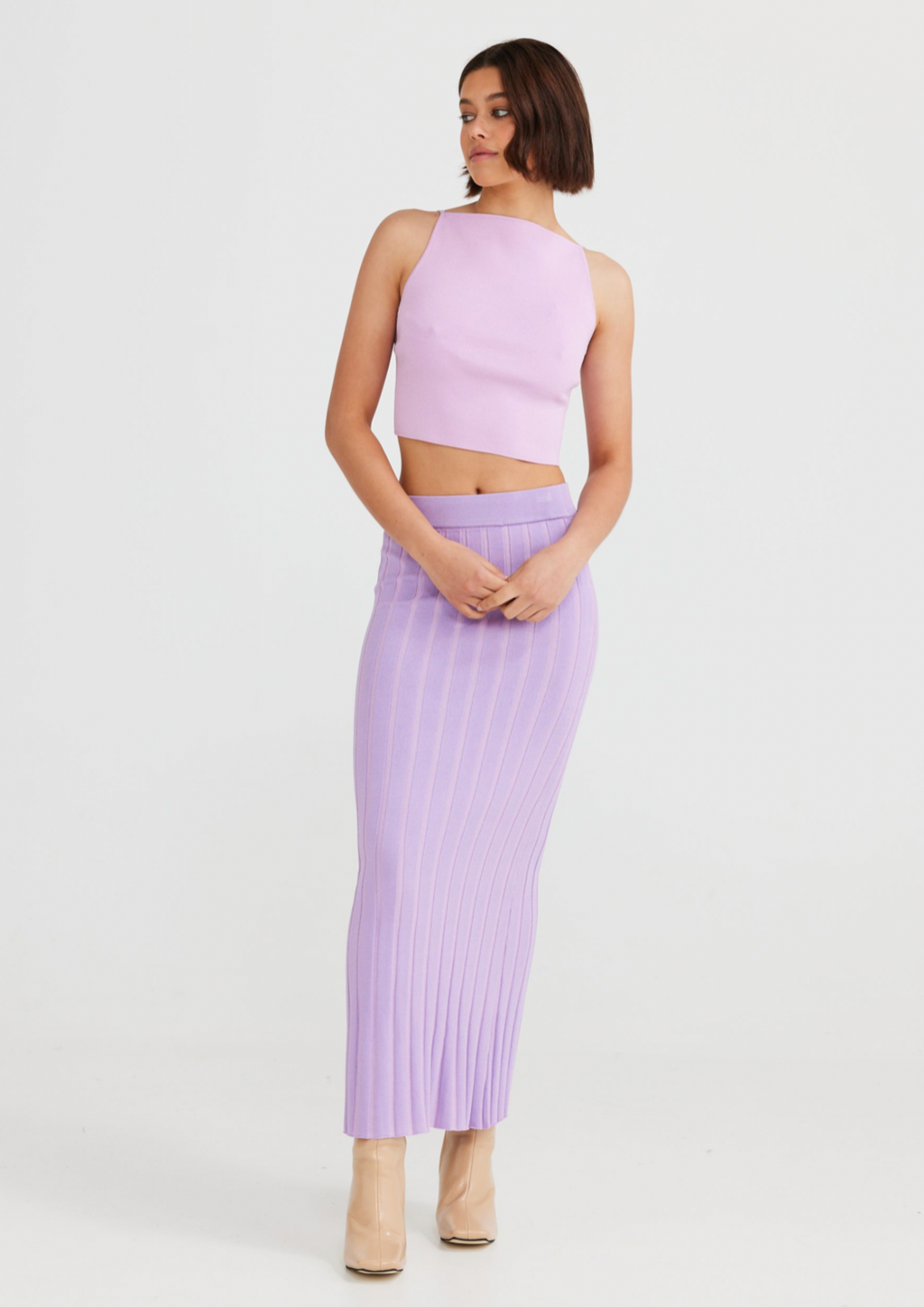Lola Skirt - Lilac, by Daisy Says Features:  ELASTIC WAIST TWO-TONE RIBBED KNIT DESIGN FIGURE SKIMMING SILHOUETTE MAXI LENGTH  Sizing:  Waist - S - 68cm, M - 73cm, L - 78cm  Fabric + Care:  75% VISCOSE 25% POLYESTER  COLD DELICATE MACHINE WASH                                   WITH LIKE COLOURS DO NOT BLEACH, SOAK OR RUB (X) DO NOT TUMBLE DRY (X) LINE DRY IN SHADE WITHOUT DELAY WARM IRON INSIDE OUT DO NOT DRY CLEAN (X)