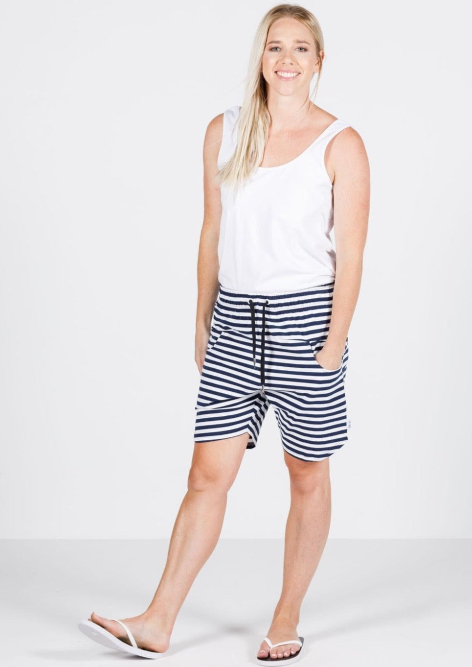 Apartment Shorts - Navy/White Stripe  The newest member of the Apartment Pant family by kiwi brand Home-Lee, and the most comfortable shorts you'll wear this summer!  Details: Elasticated waist with white drawstring.   Cotton/elastane fabric for the ultimate feel and stretch.  Designed to sit just above the knee and have a slight curve on the hem  Fresh/nautical Navy & White Stripe.